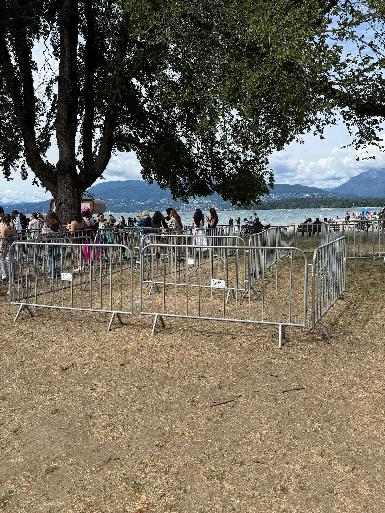 Interlocking steel barriers forming a queue enclosure at a Vancouver event.